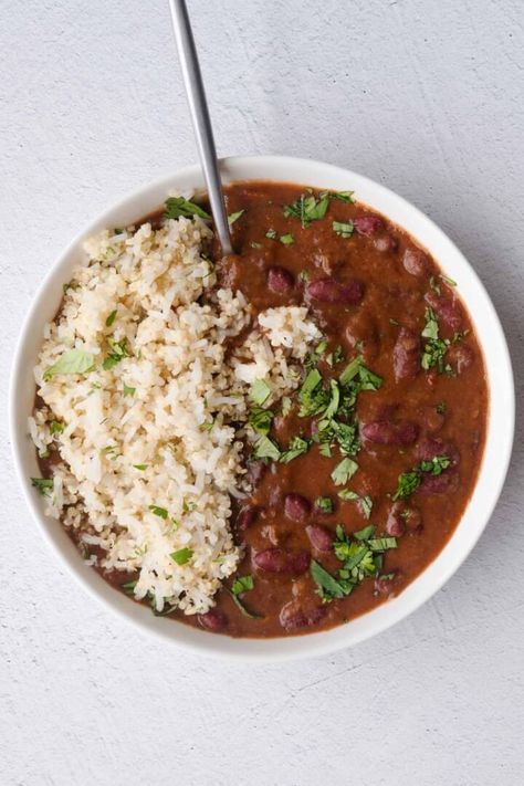 This Vegan Red Beans and Rice recipe is a healthy version of the traditional Louisiana dish. It's quick to prep, and most of the cooking time is hand-off. I make this weekly as part of my meal prep. Refrigerate for 5 days, or freeze. Stovetop and Instant Pot directions below. Sweet Potato And Chickpeas, Vegan Red Beans And Rice, Red Beans And Rice Recipe Crockpot, Protein Entrees, Vegan Red Beans, Veggie Roast, Vegan Bean Recipes, Red Beans And Rice Recipe, Maple Dressing