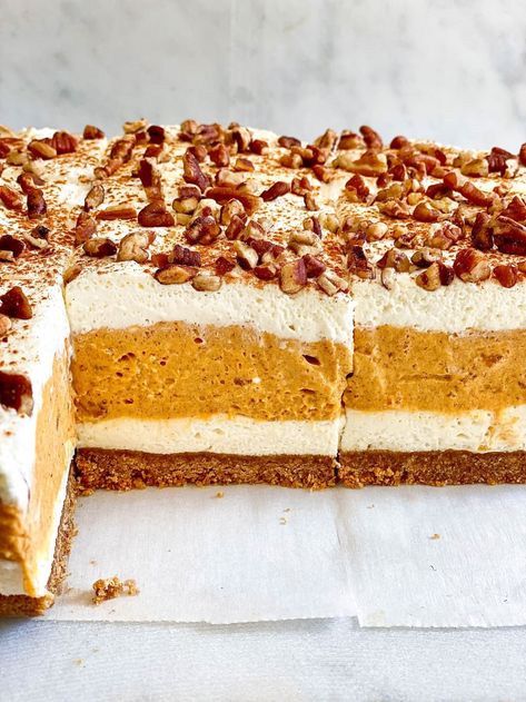 No-Bake Pumpkin Delight on display. Pumpkin Delight Dessert Easy, Pumpkin Cheesecake Delight, No Bake Pumpkin Delight The Kitchen, Pumpkin Pie Lush Dessert, Pumpkin Cheesecake Delight No Bake, Pumpkin Delight Dessert Recipe, Bunco Desserts, Cheesecake Delight, Gelatin Desserts