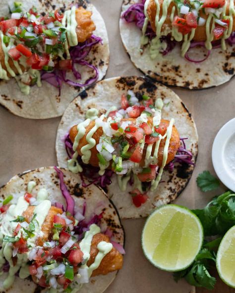 Baja Fish Tacos are beer battered and fried until crispy. Place them in a warm tortilla with a cabbage slaw, avocado crema and pico de gallo. Lingcod Fish Tacos, Authentic Fish Tacos, Crispy Fish Tacos With Cabbage Slaw, Fish Tacos Cod, Seafood Extravaganza, Birria Tacos Recipe, Southwestern Food, Fish Taco Recipe, Battered Fish Tacos