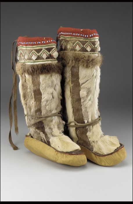 Woman's boots (Yup'ik - Yupik Eskimo), circa 1910, Caribou hide/skin, hide, wool cloth, wool yarn, glass bead/beads, and sinew. These boots keep them warm in harsh winter weather. Indigenous Winter Clothing, Yupik Clothing, Inuit Boots, Native Moccasins, Inuit Clothing, Woman's Boots, Native American Moccasins, Harsh Winter, Native American Clothing