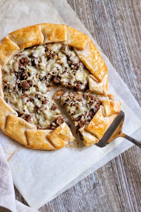 Savory galette recipes are great as an appetizer or for brunch. If you're searching for savory galettes, look no further than this delicious sausage, caramelized onion, and mushroom galette. This sausage galette is easy to prepare thanks to the shortcut of starting with prepared pie crust dough, but you can make it with your own homemade dough as well. Click or visit FabEveryday.com for the savory galette recipe and a variation to make a football galette for a game day watch party or tailgate. Gallete Recipe, Galette Recipe Desserts, Galette Recipe Savory, Mushroom Galette, Savory Galette, Galette Recipes, Caramelized Onions And Mushrooms, Custard Cake Recipes, Pie Crust Dough