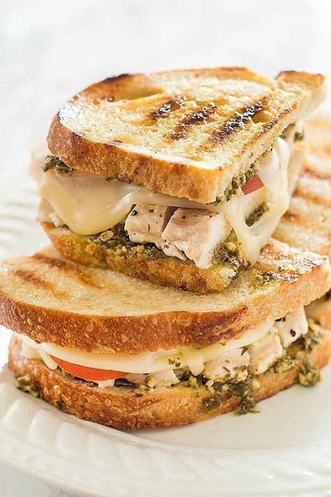 This Pesto Chicken Sandwich on Sourdough, toasted in olive oil and topped with grilled chicken, pesto, Swiss cheese, and fresh tomatoes is a perfect easy dinner. From BakingMischief.com Chicken Sandwich On Sourdough, Sandwich On Sourdough, Pesto Chicken Sandwich, Grilled Chicken Pesto, Chicken Pesto Panini, Pesto Panini, Grilled Chicken Sandwich Recipes, Chicken Pesto Sandwich, Chicken Sandwich Recipe