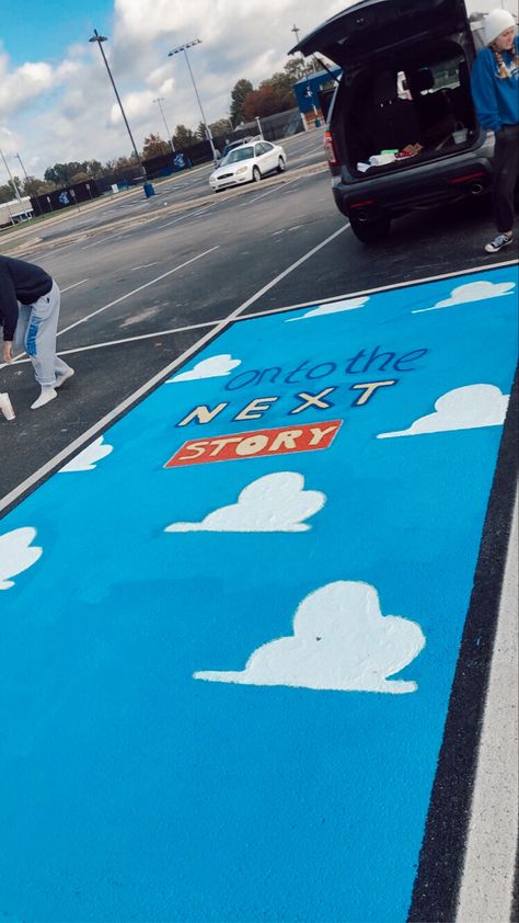 Dinosaur Senior Parking Spot, Toy Story Senior Parking Spots, Blue Parking Spot Ideas, Toy Story Parking Spot Painting, Senior Curb Painting, Parking Spot Painting For Teachers, Parking Spot Painting High School Boys, Senior Parking Spot Disney, Painted Senior Parking Spot Ideas