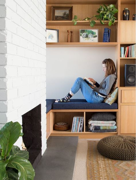 Painted brick and built-in seat and storage. #paintedbrick Corner Built In Shelves, Tv Alcove, Dj Console, Alcove Storage, Clifton Hill, Bookshelves In Living Room, Sustainable Building, Built In Seating, Living Room Shelves