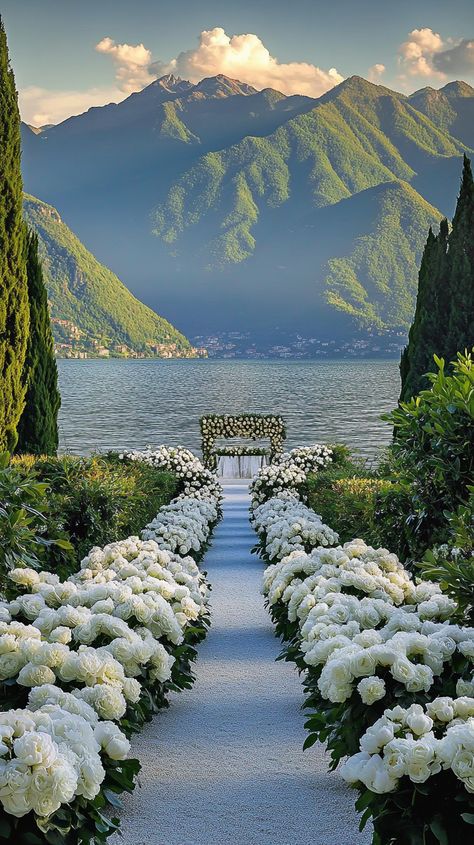 Imagine an elegant outdoor wedding at Lake Como, surrounded by romantic floral serenity. Let us capture your magical moments with breathtaking videography! 🌹✨ #Midjourney #LakeComoWedding #FloralSerenity #WeddingVideography Lake Como Italy Wedding Star Wars, Wedding Ideas Lake Como, Italy Lake Wedding, Cool Places To Get Married, Formal Mountain Wedding, Lake Como Micro Wedding, Italy Wedding Elopement, Lake Coming Wedding, Wedding Ideas Italy