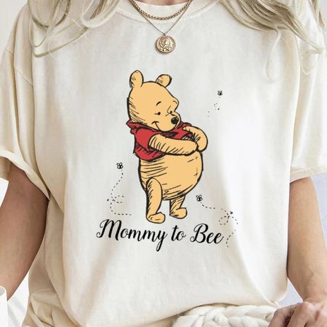 Sizzling hot deal! Winnie The Pooh Mommy To Bee Shirt, Funny Graphic Tee, Family Shirt, Family Matching Tee, Magic Kingdom Shirt, Mickey Mouse Shirt, available at a breathless price of $32.00 Ignite the town! #TShirtsForWomen #gift #TShirt #GiftForMom #shirt #GiftForHer #clothing #FunnyShirt #BirthdayGift #TShirt Magic Kingdom Shirt, Mother Days Gift, Bee Shirt, Mickey Mouse Shirt, Mommy To Bee, Mickey Mouse Shirts, Autumn T Shirts, Matching Tees, Family Shirt