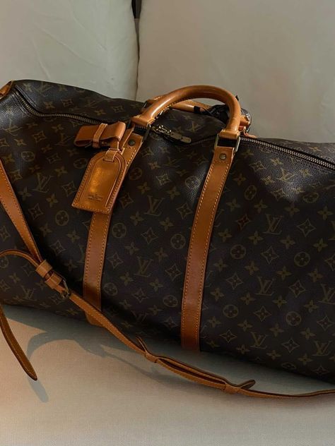 Shop our range of vintage Louis Vuitton Keepall at The Vintage Bar (www.thevintagebar.com) Louis Vuitton Weekender Bag, Lv Duffle Bag Outfit, Louis Vuitton Keepall Aesthetic, Luxury Vintage Weekender Bag, Louis Vuitton Vintage, Louis Vuitton Vintage Bag, Louis Vuitton Holdall, Louis Vuitton Duffle Bag, Designer Travel Bags