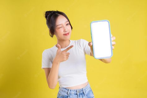 Posing With Phone, Woman Holding Phone, Women Advertising, Holding Phone, Digital Advertising Design, Hand Phone, Pointing Hand, Boys Long Hairstyles, Fashion Photography Inspiration