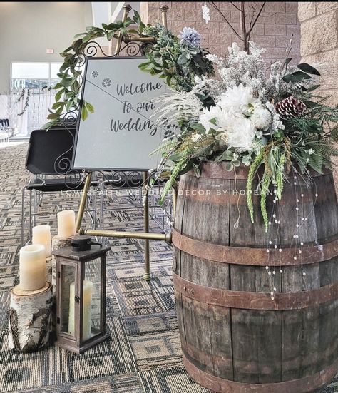 Winter wedding? This example shows the use of a great grouping with a rustic whiskey barrel to welcome your guests. Whiskey Barrel Wedding Decor, Used Whiskey Barrels, Barrel Wedding Decor, Whiskey Barrel Wedding, Barrel Wedding, Winter Florals, Romantic Anniversary Gifts, Woodsy Wedding, Winter Wedding Decorations