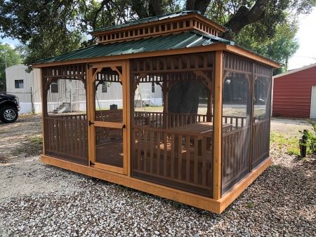 Light wood gazebo with shade screen and green tin roof - Plant City Sheds Green Tin Roof, Roof Plants, Wood Gazebo, Screened Gazebo, Shade Screen, Wooden Gazebo, Plant City, Tin Roof, Light Wood