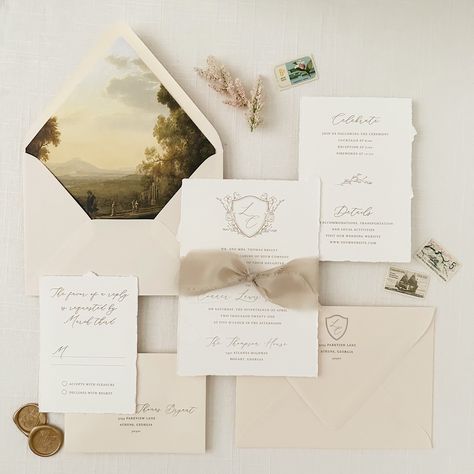 "This beautiful Gold Crest Invitation Suite is classic, yet on-trend.  Perfect for a traditional, garden or a Bridgerton-inspired wedding.  This invitation set features a floral illustrated monogrammed crest,  hand calligraphy script and block fonts flat printed in a soft gold/beige ink on natural white hand torn cotton cardstock. The neutral colors of the invitation pair beautifully with our Barely There Blush Envelopes.  Add the stunning antique landscape printed envelope liners and beige fray Texture Wedding Invitation, Wedding Invitations Beige, Toile Wedding Invitations, Classic Neutral Wedding, Venue Invitation, Crest Invitation, Crest Wedding Invitations, Sample Invitation, Vintage Envelope