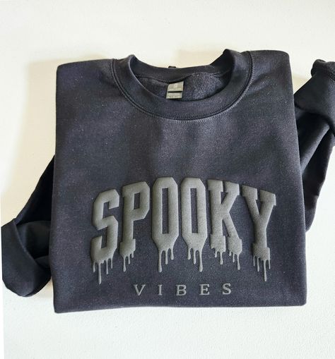 with this Spooky Vibes Puff Halloween Sweatshirt Get into the Halloween spirit  This crewneck shirt features embossed raised letters for a unique and festive look. The puff print design adds a fun texture to this spooky season shirt - making it a great gift for any Halloween enthusiast. Whether you're celebrating in style or just looking for a cute and cozy top to wear, this sweatshirt is sure to impress. PLEASE WRITE YOUR PUFF COLOR IN THE PERSONNALISATION BOX  Puff Colors : Black, Red, White, Black Puff Vinyl On Black Shirt, Puff Vinyl Sweatshirt, Kids Puff, Halloween Apparel, Raised Letters, Shirt Making, Cozy Tops, Green Aqua, Puff Print