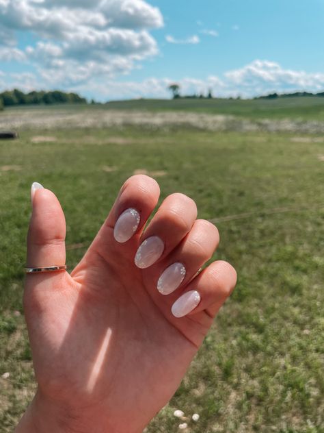 These elegant floral bridal nails have a milky white base with white and yellow flowers painted on. It’s a great, simple bridal nail for a wildflower wedding. The rounded nails are dip base with gel on top. Milky White Flower Nails, Milky White Nails With Flowers, White Floral Nails, Simple Bridal Nails, Rounded Nails, White And Yellow Flowers, Bridal Nail, Flowers Painted, Wedding Nails Design