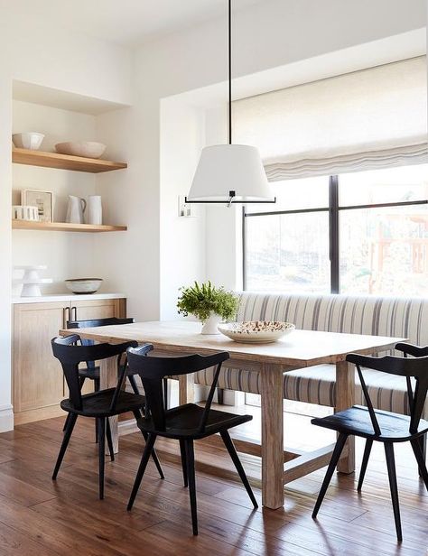 Light wood dining table surrounded by sleek black chairs under a white drum hanging light. A striped upholstered dining bench features gray and blue fabric against a dining room window fitted with a linen roman shade. Amanda Teal Design Modern Farmhouse Dining Room Lighting, Light Wood Dining Table, Upholstered Dining Bench, Modern Farmhouse Dining Room, Dining Room Design Modern, Dining Room Windows, Modern Farmhouse Dining, Casa Country, Dining Room Inspiration