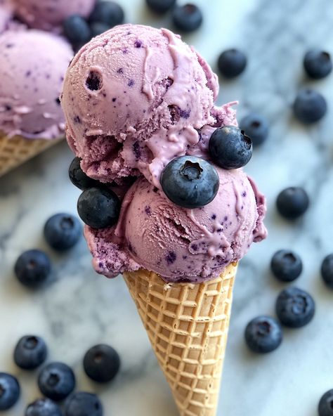 "This blueberry cheesecake ice cream is a delightful treat that will make you smile with every scoop! It's creamy, fruity, and simply irresistible.   For three decades, I’ve been perfecting this recipe, which blends my love for cheesecake and ice cream. One bite and you'll understand why it’s a family favorite!  Ingredients: - 2 cups fresh blueberries - 1 cup cream cheese - 1 cup heavy cream For the rest of the ingredients and the full recipe, please check the link in the first comment [👇] [👇]  This ice cream is perfect for hot days or cozy nights. Enjoy it in a cone or a bowl, and feel the happiness with each flavor!  #BlueberryCheesecake #IceCreamLovers #DessertTime #SummerTreats #HomemadeIceCream" Blueberry Muffin Ice Cream, Blue Cheese Ice Cream, Blueberry Cheesecake Ice Cream, Blue Ice Cream Aesthetic, Blueberry Lavender Ice Cream, Blueberry Ice Cream Aesthetic, Fancy Ice Cream, Blueberry Ice Cream, Cheesecake Ice Cream