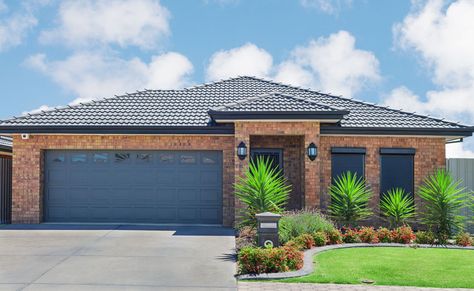 Blue garage door brick house Blue Garage Door, Blue Garage, Garage Door Colors, Window Shutters Exterior, Casa Garage, Tan House, Garage Door Design, Red Brick House, Brick Exterior House