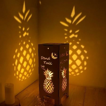 Our brand has always been committed to creating functional and eye catching night light lamp projection. You can also use many of our night light lamp projection to decorate your house/bedroom/living room. What You Get: Number of Pineapple Night Light: 1PCS Size of Pineapple Lamp Projection: 5.5"L x 5.5"W x 13.5"H NOTE: Due to the nature of wood, each lamp will have a wood grain that is slightly different than the one you see in the picture. This adds a uniqueness to your lamp! Purchase Hassle-F Farmhouse Lantern Decor, Wood Pineapple, Pineapple Lights, Pineapple Wall Art, Pineapple Lamp, Light Projection, Living Room Vintage, Pvc Pipe Crafts, Large Lanterns