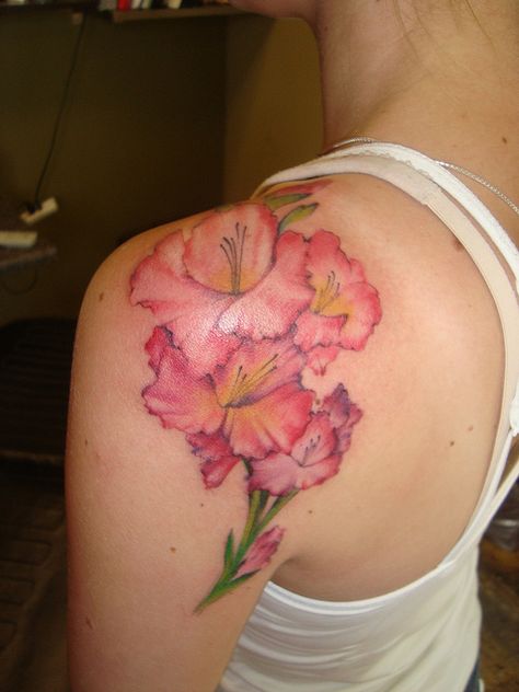 Gladiola shoulder tattoo Gladiolas Tattoo, Gladiolus Flower Tattoo, Delphinium Tattoo, Gladiolus Flower Tattoos, Jewerly Tattoo, Flower Tats, Gladiolus Tattoo, Lily Flower Tattoos, Floral Tattoo Shoulder