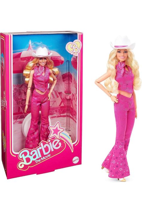 ​Barbie celebrates Barbie The Movie with a collector doll in eye-catching western outfit that features a matching vest and V-waist flare jeans. Barbie doll's pink denim look features luxe details; contrast stitching, embroidery, silver buttons, and star embellishments. ​Her cream and gold cowboy boots like the ones Margot Robbie’s Barbie wears in the feature film! ​Additional accessories; cowboy hat and star-print bandana. Her all-pink getup puts a fun Barbie twist on western style! Pink Western Outfit, Barbie In Pink, Barbie Merchandise, Nails Barbie, Barbie 2023, Barbie The Movie, Baby Pony, Dream Husband, Chapeau Cowboy