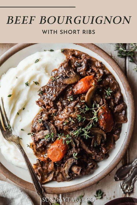 This short rib beef bourguignon is a rich and savory stew based on the traditional French recipe! With red wine, herbs, mushrooms, carrots, and shallots, it's an impressive dinner party meal that is super easy to make. It can be made in the slower cooker or in a Dutch oven for a melt-in-your-mouth beef stew. Feel free to make this recipe with boneless or bone-in short ribs - they both work great! It's perfect with side dishes like mashed potatoes, buttered noodles, rice pilaf, or creamy ... Short Ribs Stew Recipe, Boneless Short Ribs Recipe Dutch Oven, Bone In Short Ribs Recipe, Short Ribs In Crockpot, Rib Stew Recipe, Short Ribs With Mushrooms, Boneless Short Ribs Recipe, Beef Short Rib Recipes Oven, Short Ribs Dutch Oven