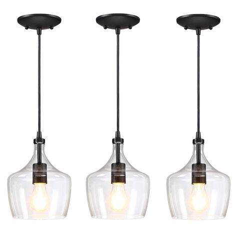 The 3-pack 1-light Mini Pendant with dark bronze finish and clear glass shade Illuminates your space in industrial style, the design of rounded glass creates a subtle accent that is ideal for any hallway, kitchen, or living room in your home, it is also ideal for real farmhouse, rustic and industrial, with one incandescent bulb of up to 60-Watt ceils inside the glass (Bulbs are not included). An adjustable length of wire with a matching canopy above to round out the design. Mount this classic Mi Real Farmhouse, Lights Over Island, Lights Over Kitchen Island, Island Light Fixtures, Farmhouse Kitchen Lighting, Black Kitchen Island, Black Light Fixture, Farmhouse Pendant Lighting, Island Pendant Lights