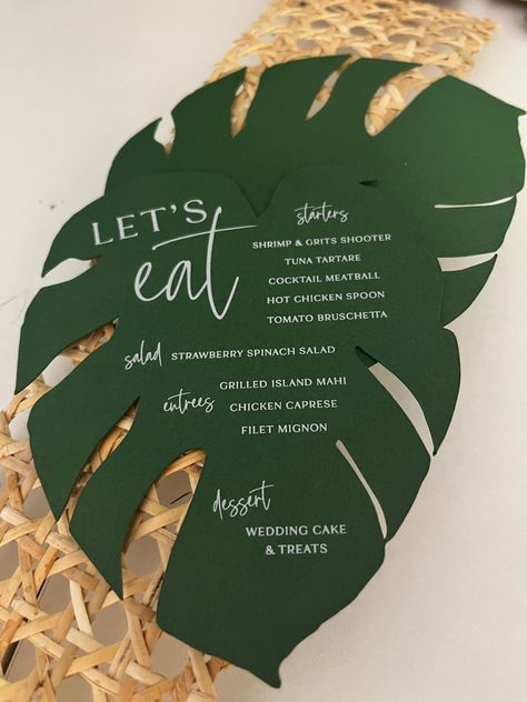 Calling all tropical plant lovers 🌴:These monstera menus are the coolest element you can add to any events table! Pairs nicely with a colorful napkin and is bound to make your guest excited to eat! 🪴💗🙌🏽   #wilmingtonnc #customweddinginvitations #custominvitations #weddingdetails #weddingdesign #stationerydesign #weddingstationery #weddingplanning #weddinginspiration #weddinginspo #weddingideas #stationery #weddingdecor #modernwedding Wedding Invitations Tropical Theme, Tropical Wedding Stationery, Tropical Menu Design, Monstera Wedding, Menu Table, Tropical Wedding Theme, Thailand Beach, 30th Party, Dream Wedding Decorations