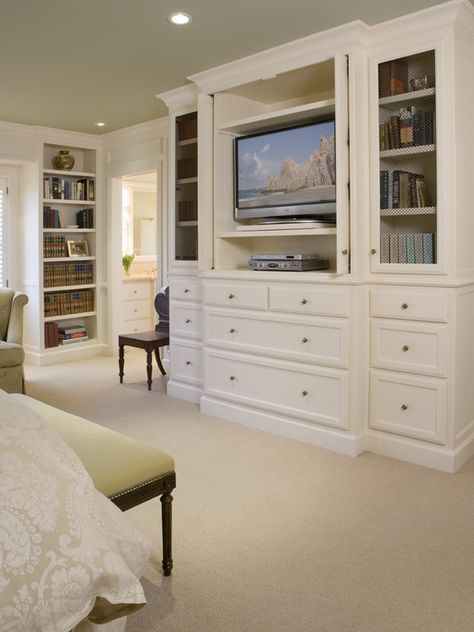 Love this idea. Built ins to hide the TV in the bedroom. Plus the shelving/storage for DVDs etc.  Nobody wants to see that stuff in their bedroom Hidden Tv Bedroom, Bedroom Upgrades, Built In Bookshelves, Traditional Bedroom Design, Bedroom Built Ins, Bedroom Organization, Tv In Bedroom, Wall Units, Master Bed