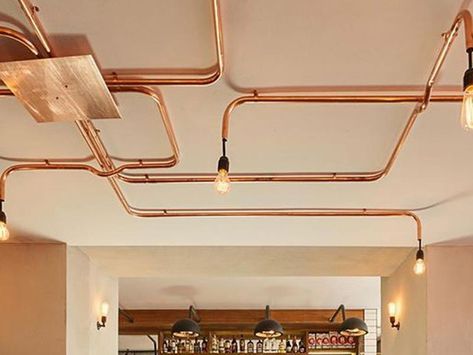 Exposed copper pipes Pipe Lighting Ceiling, Exposed Wiring, Conduit Lighting, Ceiling Lamp Design, Light Switches And Sockets, Ceiling Materials, Copper Ceiling, Pipe Lighting, Brick And Wood