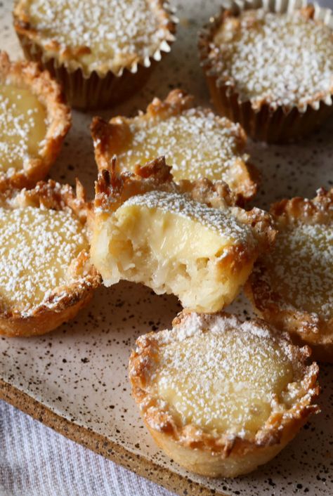 These sweet Lemon Coconut Tassies have a coconut macaroon-style crust with a sweet homemade lemon filling. Easy to make, great to freeze, and perfect for entertaining! #cookiesandcups #imperialsugar #partner Lemon Tassies, Summer Baked Goods, Baking Biscuits, Cookies And Cups, Lemon Dessert Recipes, Lemon Filling, Lemon Coconut, Sweet Lemon, Coconut Macaroons