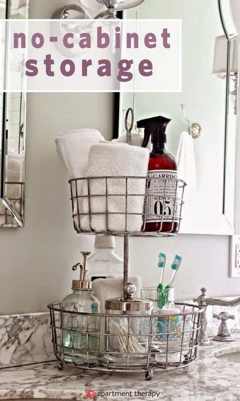 It may seem like you've got no potential for stylish and functional storage, but all hope is not lost. There are plenty of ways you can sneak in extra storage in a cabinet-less bathroom. If you need inspiration, here are some solutions and projects to try. Organizing With Baskets, Easy Bathroom Organization, Diy Bathroom Storage Ideas, Bathroom Counter Organization, Small Bathroom Organization, Diy Bathroom Storage, Bathroom Organization Diy, Home Goods Store, Bathroom Counters