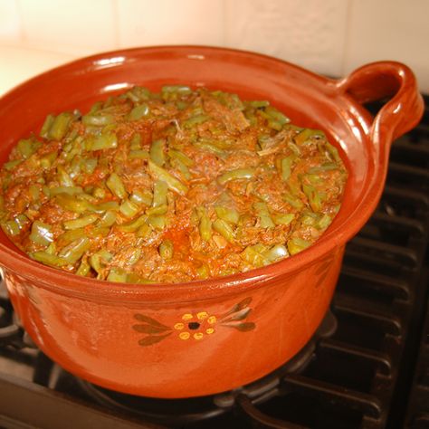 Many people are intimidated by Nopales, or Prickly Pear Cactus paddles, not only because of their appearance in their uncooked state, but also because of their texture and sliminess. Like okra, you will either love them or hate them. Washing the cut Nopales with water several time helps reduce the slime.    Product Featured in this Recipe      Mexican Lidded Cazuela Nopalitos Recipe, Nopales Recipe, Red Chile Sauce, Red Chili Sauce, Recipe Mexican, Chile Sauce, Red Chile, Pear Cactus, Prickly Pear Cactus