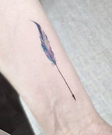 Colorful Quill Arrow Tattoo, 19 Arrow Tattoos That Are Surprisingly Chic - (Page 4) Veer Tattoo, Vertical Tattoos, Arrow Tat, Arrow Tattoo Ideas, Courage Tattoo, Feather Arrow Tattoo, Watercolor Arrow Tattoo, Quill Tattoo, Arrow Tattoos For Women