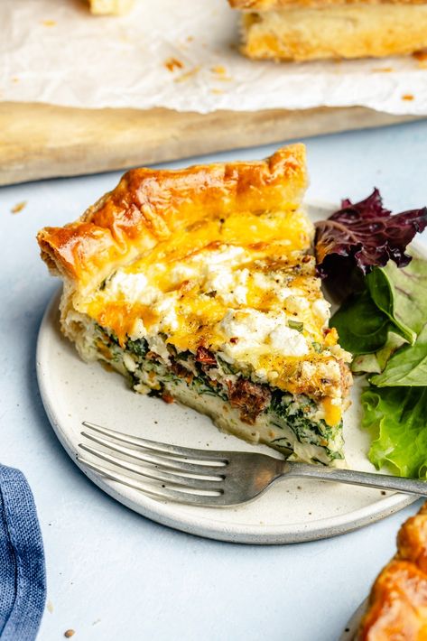 Delicious spinach and sun-dried tomato puff pastry quiche packed with fresh basil and plenty of protein from eggs and cottage cheese. This easy, veggie-packed puff pastry quiche has two types of cheese for extra savory flavor, plus plenty of ways to customize with your favorite mix-ins! The perfect breakfast or brunch recipe everyone will love.