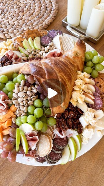 Samantha Bauchmann on Instagram: "THANKSGIVING BAKED CORNUCOPIA BOARD // This is the definition of so easy but so impressing!  I have ALWAYS wanted to make one of these for a thanksgiving charcuterie board and I finally did it! 

INGREDIENTS:
2 cans pillsbury pizza dough
Flour (for rolling out dough)
2 eggs + splash of milk (whisk to make egg wash)
Aluminum foil
Non stick cooking spray

INSTRUCTIONS:
1) Preheat oven according to directions on pizza dough cans, then pop open cans and roll out on a floured surface (into a rectangle). Cut long strips of pizza dough and set aside. Roll a long cone of aluminum foil, filling with falls of aluminum foil (to keep it’s shape) and bending the tail upwards. Generously spray cone + cookie sheet with non stick cooking spray.

2) Using the egg wash as a Samantha Bauchmann, Charcuterie Items, Pillsbury Pizza Dough, Pillsbury Pizza, Thanksgiving Charcuterie Board, 2023 Thanksgiving, Thanksgiving Charcuterie, Food Appetizers, Cooking Spray