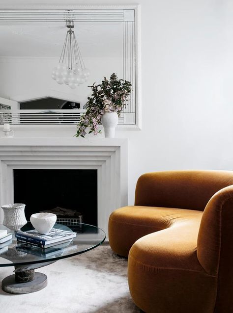 An elegant, classic living room features a white fireplace and a mustard curved sofa. Cosy Fireplace, Mission Style Homes, Mission House, Spanish Queen, Lounge Design, Sofa Living Room, Curved Sofa, Sofa Living, Australian Homes