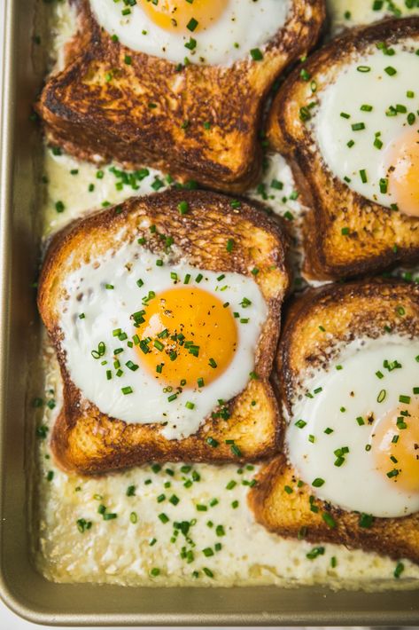 French Baked Toast with Eggs and Cream | Despite the seemingly fancy French name, just think of this as a savory French toast!  Toasted brioche slices are topped with an egg and baked in a puddle of cream that thickens into a béchamel-like sauce for dipping.  Top with fresh chives and a sprinkle of Piment d’Espelette if you dare.  Perfect as a luxurious (yet simple) egg dish for brunch parties and breakfast-for-ones alike!   #food #recipe #eggs #breakfast Baked Toast, French Toast Brioche, Brunch Egg Dishes, Savory French Toast, Egg Baked, Easy French Toast Bake, French Eggs, Savoury French Toast, Easy French Toast Recipe