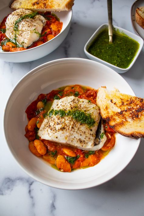 Baked Fish Over Tomato Bean Stew with Herb Oil | Jen's Rooted Kitchen Fish And Tomatoes, Oily Fish Recipes, Winter Fish Recipes, Healthy Homesteader, Yacht Food, Homesteader Recipes, Pesto Fish, Fish Tomato, Fish Bake