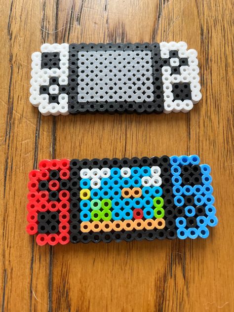 Handmade perler bead designs created by a 9 year old who loves to craft! Peeler Bead Room Decor, Perler Bead Bouquet, Bone Perler Beads, Doodle Bob Perler Beads, Fall Melty Beads, Kc Chiefs Perler Beads, Outer Banks Perler Beads, Perler Bead Templates Small, Cool Fuse Bead Ideas