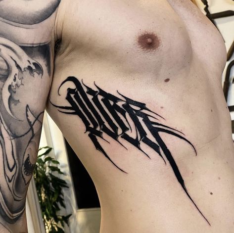 Spin Snake Tattoo, Epic Tattoos For Men, Revenge Tattoo, Dragon Rib Tattoo Men, Chest Lettering Tattoo Men, Gothic Font Stomach Tattoo, Dark Lettering Chest Tattoo, Dark Lettering Tattoo, Chest Tattoo Fonts