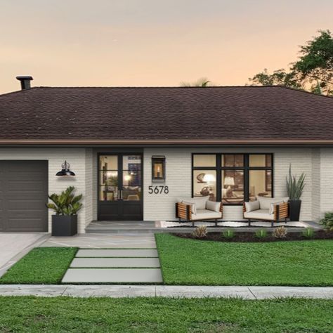 We maintained the traditional character and went with a new beautifully muted color palette which enhance the updated elements that we added to this house.We were intentional about the added walkway because It was very important to the client.The neutral color palette and open windows and glass panes make the house look more warm and welcoming.We went with a more industrial feel with the light features and also adding new landscape in the front yard making a statement piece. Exterior House Renovation, Ranch House Exterior, House Makeovers, Exterior House Remodel, Ranch Remodel, Ranch Exterior, Home Exterior Makeover, Exterior Renovation, Brick Exterior House