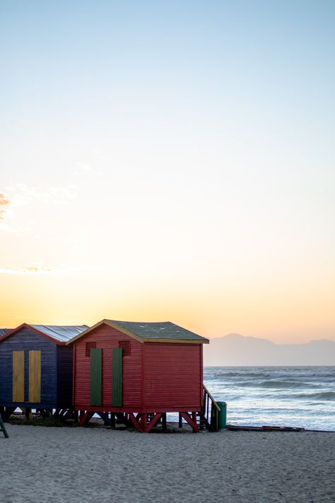 The colourful beach huts at Cape Town’s Muizenberg Beach are a throwback to the “bathing machine” of the 1800’s. Today these vibrant and photogenic huts are an Instagrammer’s delight. There are some places that are so brilliantly colourful that they can sometimes look like they’ve been photoshopped. Explore 22 of the most colourful places around the world. Muizenberg Beach, Town Pictures, Mountain Top View, Mountain City, Cloud City, Colorful Places, Concrete Building, Beach Huts, Water Bodies