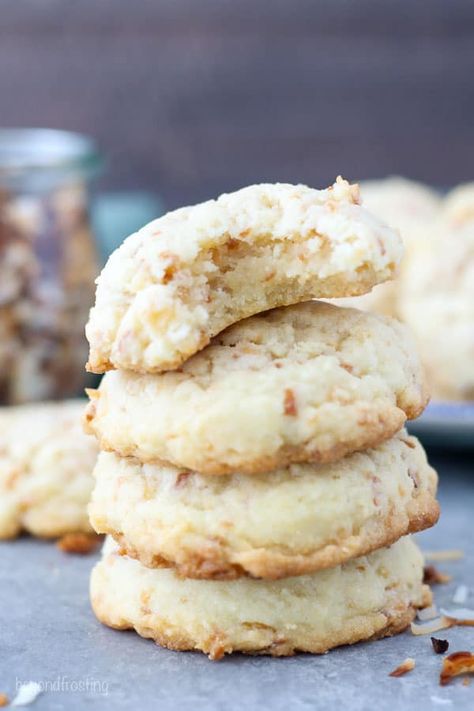 Soft and Chewy Toasted Coconut Cookies are buttery sugar cookie with a nutty aroma. These coconut cookies are loaded with toasted coconut and crispy on the outside and soft and chewy in the middle. #cookies #coconut #coconutcookies #softandchewycookies #toastedcoconut Chewy Coconut Cookies, Beyond Frosting, Crisp Cookies, Cookies Coconut, Buttery Sugar Cookies, Coconut Cookies Recipes, Coconut Desserts, Coconut Cream Pie, Almond Flavor