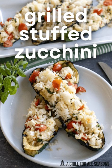 Stuffed Zucchini with rice is a great way to make a flavorful dish. Made with zucchini halves stuffed full of rice, feta, tomatoes, & basil. You'll love the flavor of this simple dish. Rice Stuffed Zucchini, Stuffed Zucchini Boats With Rice, Vegetarian Zucchini Boats, Grill Meals, Stuffed Zucchini Boats, Stuffed Zucchini, Creamy Rice, Joy Filled Eats, Zucchini Boats