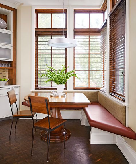 Ornate wood pedestals support a vinyl-clad banquette in the eating nook of this Chicago kitchen. More photos from this gorgeous home:  http://www.midwestliving.com/homes/decorating-ideas/kitchen-tour-chicago-architects-home/ Kitchen Banquettes, Wall Art Paint, Corner Banquette, Inset Cabinetry, Cabinet Door Style, Kitchen Banquette, Classic White Kitchen, Kitchen Desks, Cozy Breakfast Nook