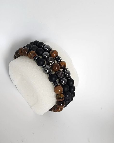 Onyx is known for its protective and grounding benefits while tiger eye beads are believed to bring balance and good fortune. Together, they create a harmonious blend of style and meaning, ideal for the modern man who values both aesthetics and symbolism. # OnyxBeadBracelet #fathersdaygifts #TigerEyeBead #HematiteJewelry #Men'sBracelet #Women'sBracelet #UnisexJewelry #BeadedJewelry #HandmadeBracelet #GiftforHim #GiftforHer #StretchBracelet #HealingStones Grounding Benefits, Hematite Jewelry, Candy Bracelet, Trending Bracelets, Tiger Eye Beads, Eye Beads, Unisex Jewelry, Logo Ideas, Good Fortune