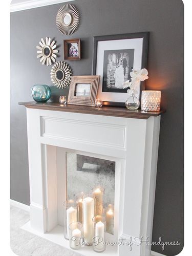 In lieu of a fire, set up a display of candles for an elegant flame. #fireplaces #decor Fake Fireplace, Faux Fireplace Diy, The Mantle, White Fireplace, Diy Casa, Faux Fireplace, Mantel Decor, The Fireplace, Fireplace Mantle