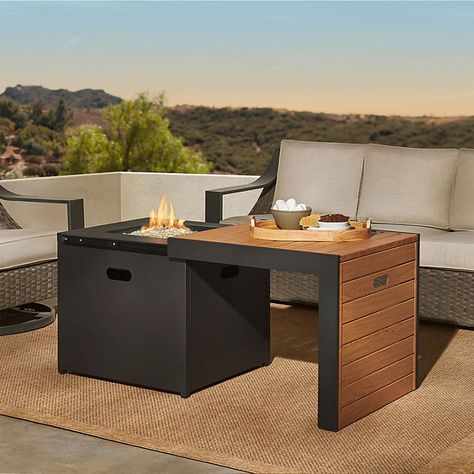 Introducing the Member’s Mark 31'' Gas Fire Pit with Sliding Table, a perfect blend of style and functionality to elevate your outdoor gatherings. This fire pit table features a stylish coated wood pattern sliding tabletop with a centerpiece fire pit, equipped with a 50,000 BTU stainless steel burner. The electric ignition system ensures easy and reliable starts every time. When not in use, the included metal lid transforms the fire pit into a traditional table, which can be conveniently stored in the door while the fire pit is in use. Fireplace Table Outdoor, Outdoor Fire Table Ideas, Fire Coffee Table, Gas Fire Pit Ideas, Patio Fire Table, San Diego Apartments, Fire Pit Coffee Table, Fire Table Patio, Fire Pits Outdoor