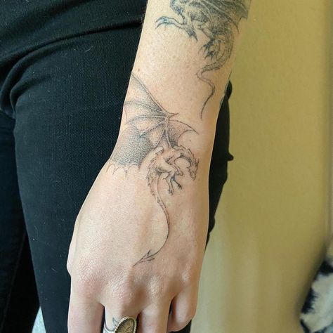 Dragon Wrapped Around Hand Tattoo, Dragon Around Wrist Tattoo, Wrist Dragon Tattoo, Tattoos Dragon, Puff The Magic Dragon Tattoo, Medieval Dragon Tattoo, Dragon Wrapped Around Arm Tattoo, Horizontal Dragon Tattoo, Dragon Hand Tattoo