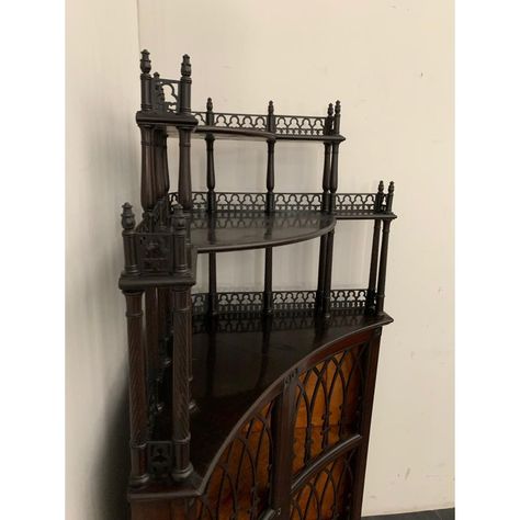 Sideboard corner cabinet, with 2 branches concave perforated in Gothic theme,  Lift 3 levels with triumph twisted columns and arches to the rear frame in the Gothic style.  The feet are spring onion  The cabinet is veneered in mahogany, ebony veneered floor, the interior is made of maple.  Exquisite and elegant example of cabinet-making Tuscany the mid-nineteenth century. Dark Wood Storage Cabinet, Gothic Art Deco Interior Design, Gothic Vendor Booth, Arabian House Decor, Gothic Homemaking, Ebony Furniture, Spooky Farmhouse Decor, Victorian Style Bookshelf, Gothic Display Cabinet