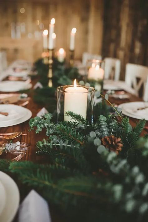 Table Tablescape Decor Spruce Greenery Pinecones Candles Christmas Wedding Ideas Mini and Me Photography #wedding #weddingdecor Pine Wedding Table Decor, Fir Wedding Decorations, Spruce Wedding Decorations, Pine Cone Wedding Decor, January Wedding Florals, Pine Themed Wedding, Emerald Wedding Table Decor, Evergreen Table Centerpieces, Christmas Baptism Ideas